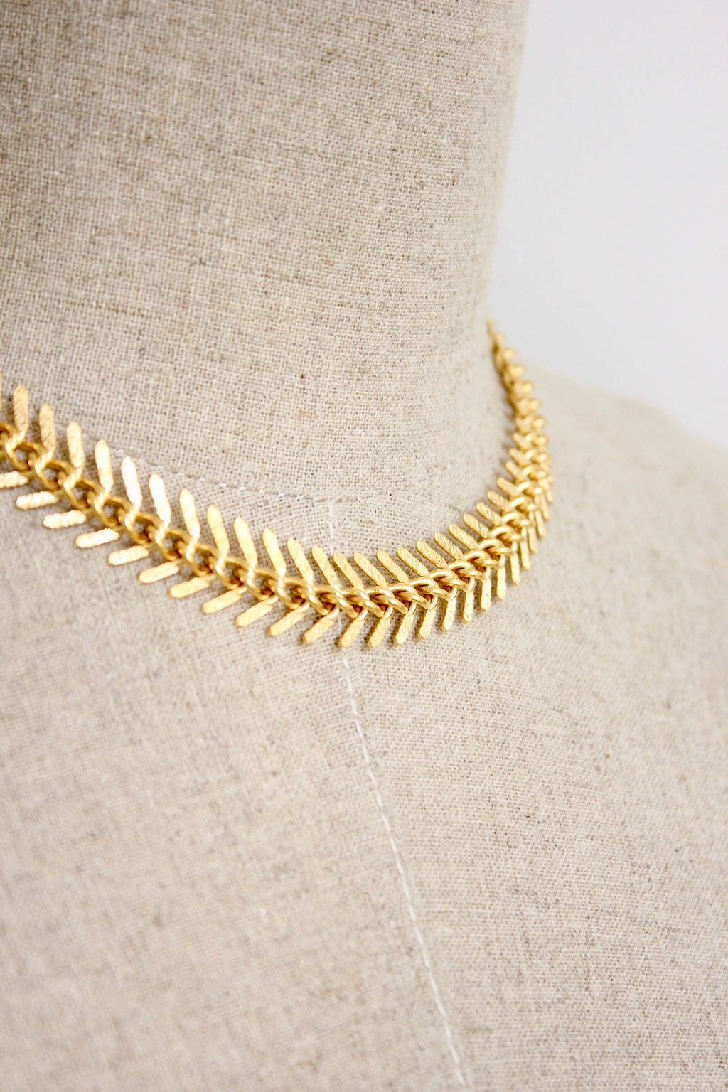 18k matte gold fish bone necklace